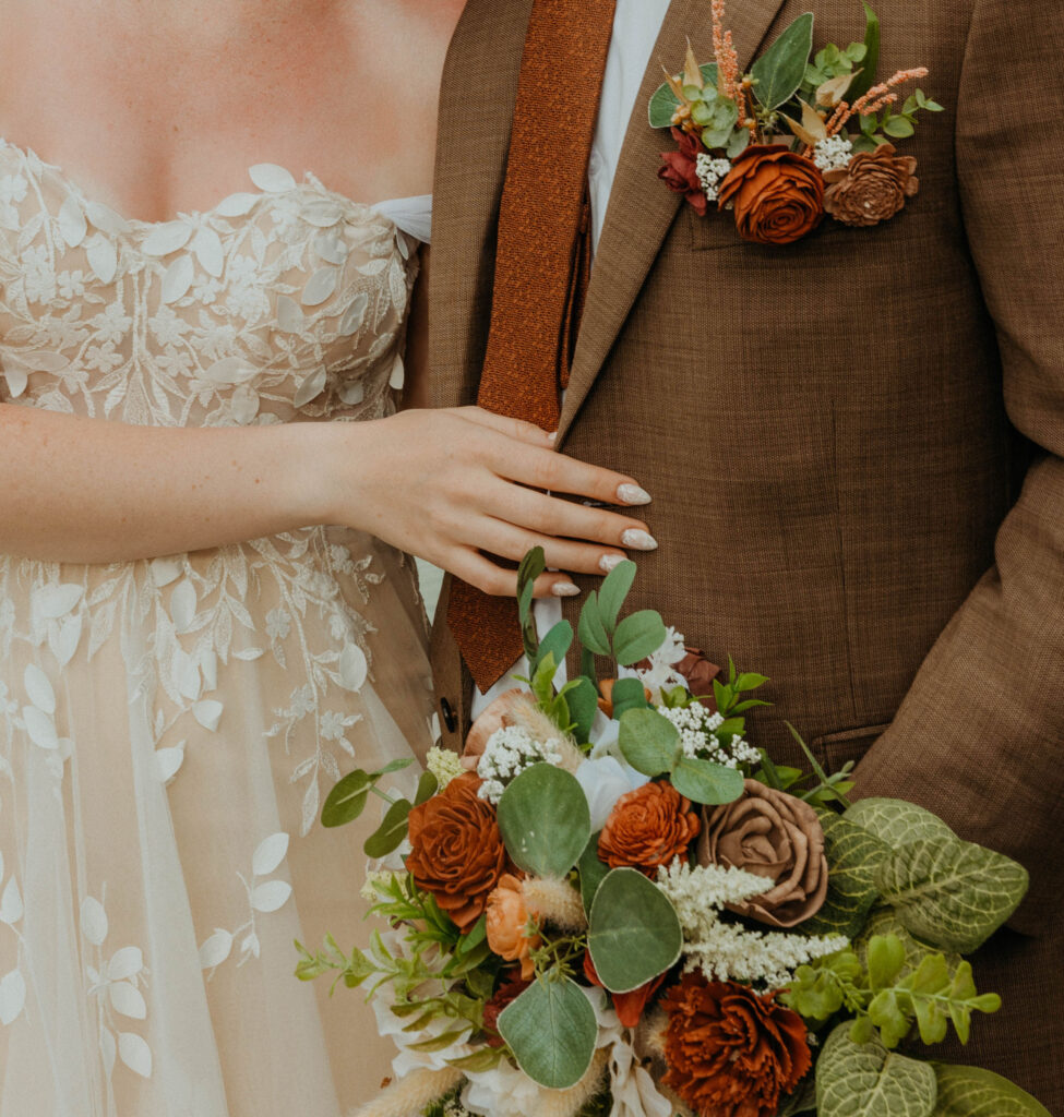 Bride and Groom with wedding flowers